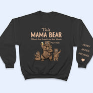 This Mama Bear Wears Her Heart - Gift For Mom, Nana - Personalized Unisex Sweatshirt With Design On Sleeve