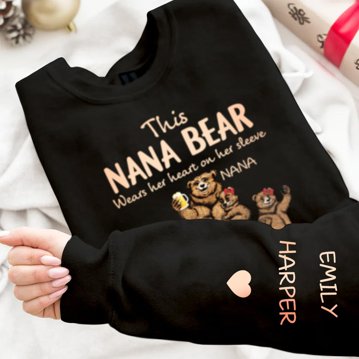 This Mama Bear Wears Her Heart - Gift For Mom, Nana - Personalized Unisex Sweatshirt With Design On Sleeve