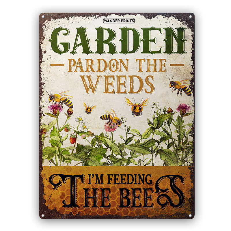 https://wanderprints.com/cdn/shop/products/Personalized-Bee-Garden-Pardon-The-Weeds-Classic-Metal-Sign-Default_1200x.jpg?v=1646050738