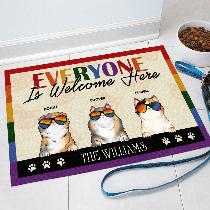 https://wanderprints.com/cdn/shop/products/Personalized-Family-Pride-Everyone-Is-Welcome-Here-Cat-Funny-Custom-Doormat-Mockup-2_1200x.jpg?v=1629694125